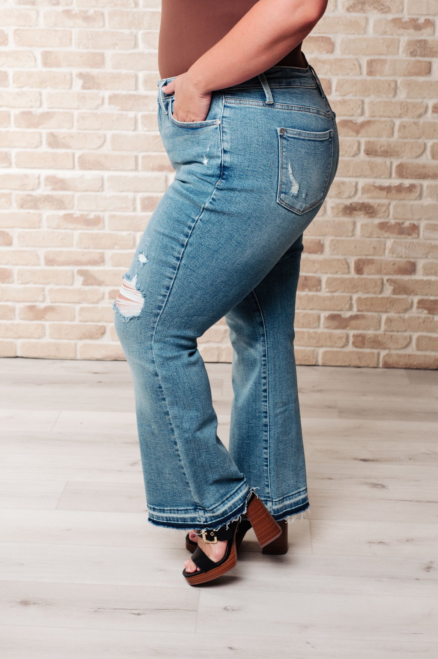 Isla Mid Rise Distressed Released Hem Bootcut Jeans